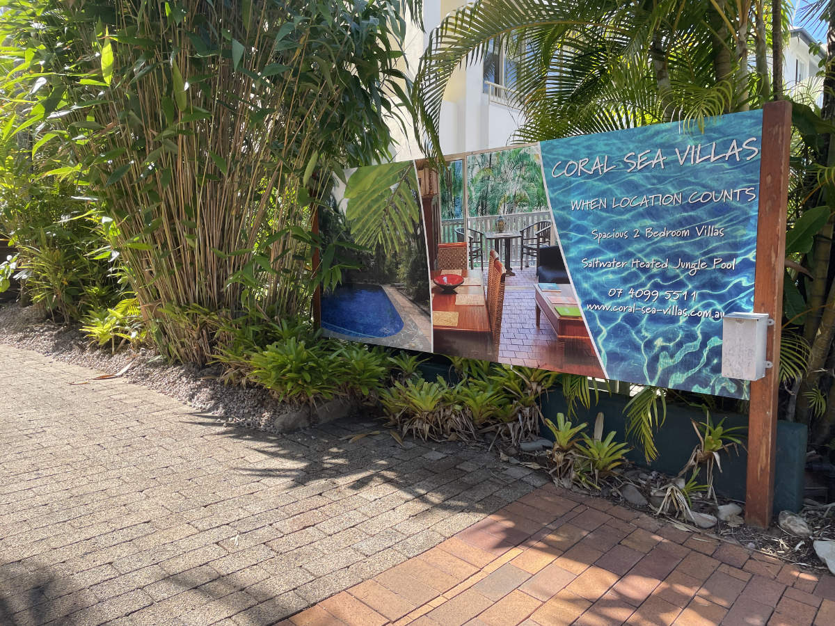 Front signage of Coral Sea Villas